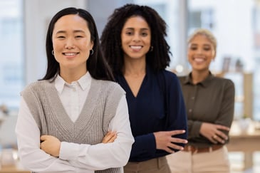 Young professionals collaborating in an office representing graduate development programmes and early career leadership training. 
