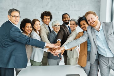 Business leaders collaborating in a strategy meeting focused on building resilient teams in a changing workplace. 