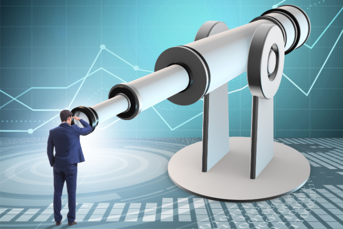 Businessman looking into the future through a huge telescope, surrounded by analytical graphics, whilst considering goals him and his team strive to meet.
